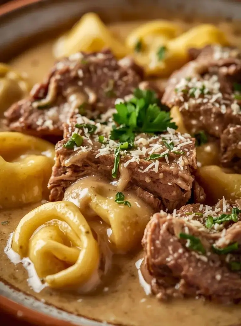 creamy garlic steak tortellini in a pan